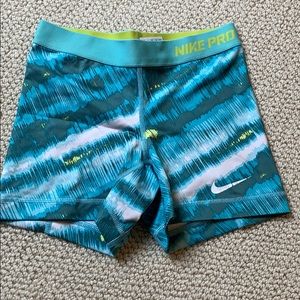 Blue/green/white tie dye looking Nike pro shorts